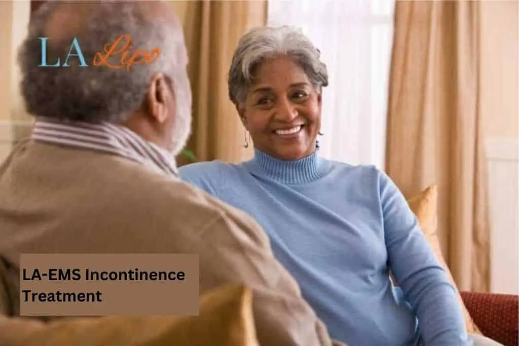 Couple sat smiling at each other - LA-EMS treatment Hertfordshire