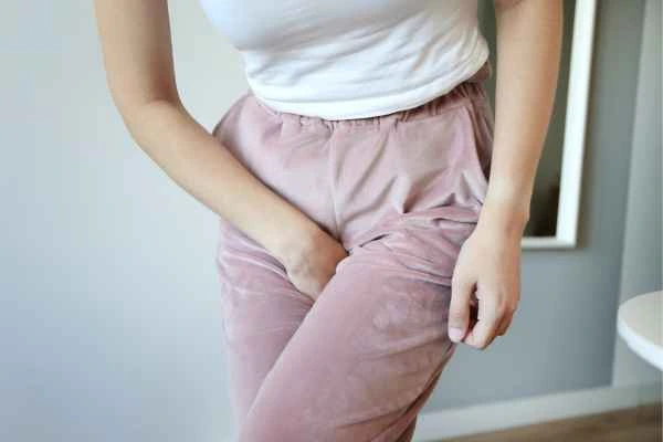 woman running for the toilet because of urinary incontinence Hertfordshire